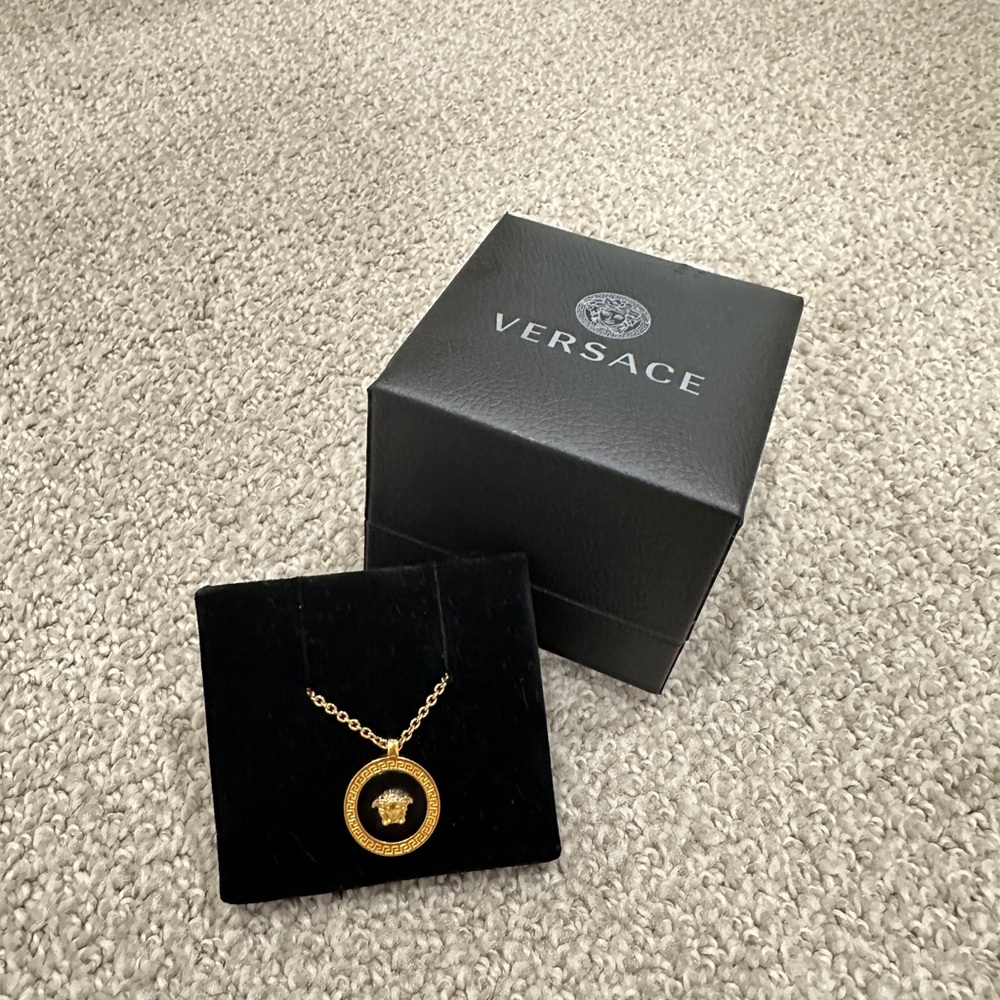 VERSACE
Gold & Black Resin Medusa Necklace